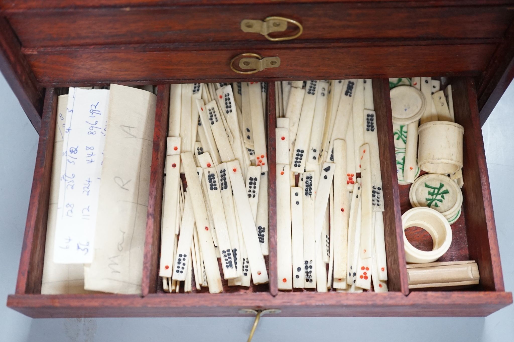 A MahJong set and a Chinese brass mounted card case., MahJong set, 15.5 cms high x 23.5 cms wide.